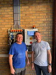 Matthew Parkinson and Steven Champion in front of one of six new EASY S systems